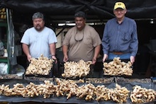 Earl Arakaki, Christopher Bernabe, and Bernie Kratky show clean ginger rhizomes